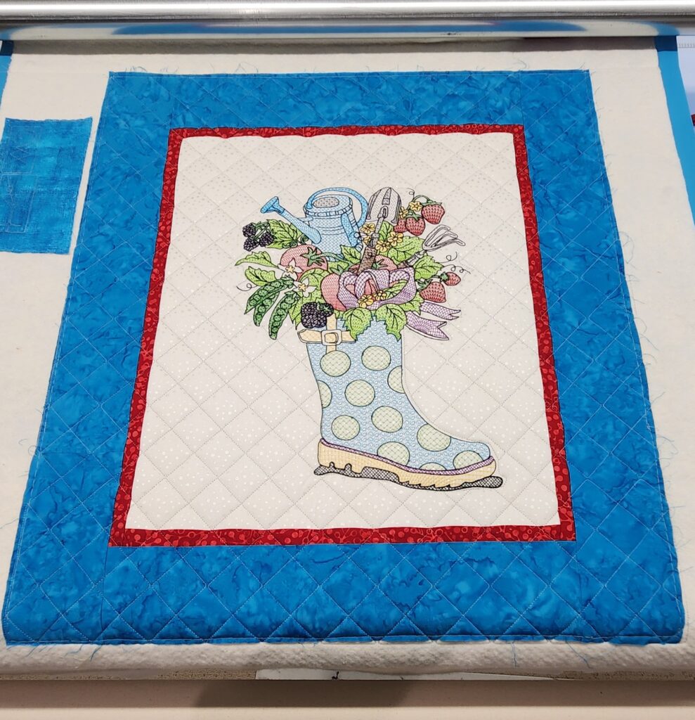 Wife embroidered quilt with custom crosshatching